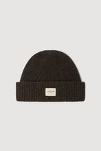 Dark brown knit beanie with a small label on a light gray background