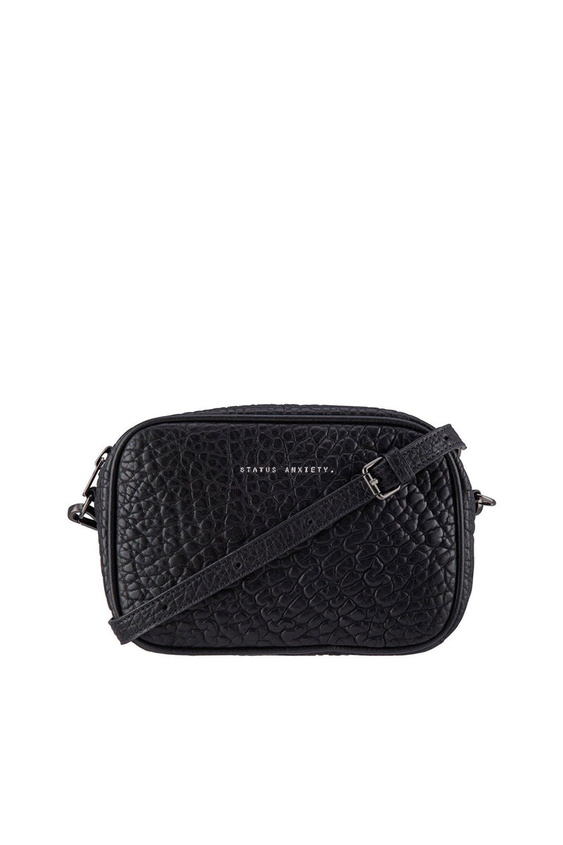 Status anxiety 2025 bags sale